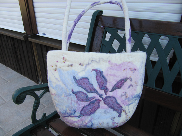 felted bag with sewed on ornaments