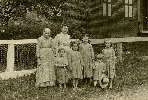 Women and Kids in Front of a House (Cropped)