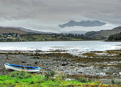 A glimpse of the Black Cuillin over Loch Portree, Isle of Skye