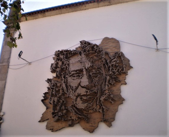 Mural of carved cork, by Vhils.
