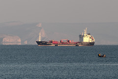 Oil tanker Skaw Provider (IMO: 9327281) in the dying sunlight against the Jurassic Coast