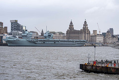 HMS Prince of Wales with the three graces in the background