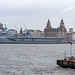 HMS Prince of Wales with the three graces in the background