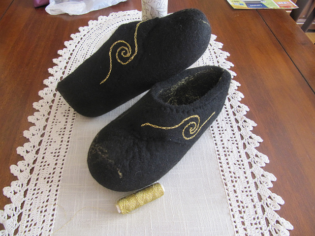 felted slippers with embroidered golden symbol
