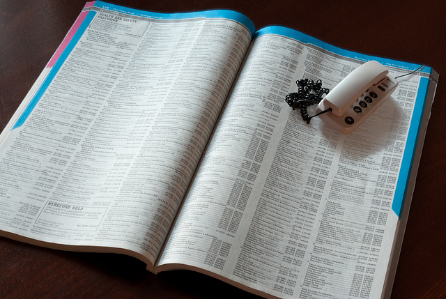 Telephone with telephone directory - photo montage