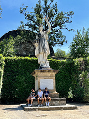Florence 2023 – Boboli Gardens – Tourists sitting at the feet of Abundance
