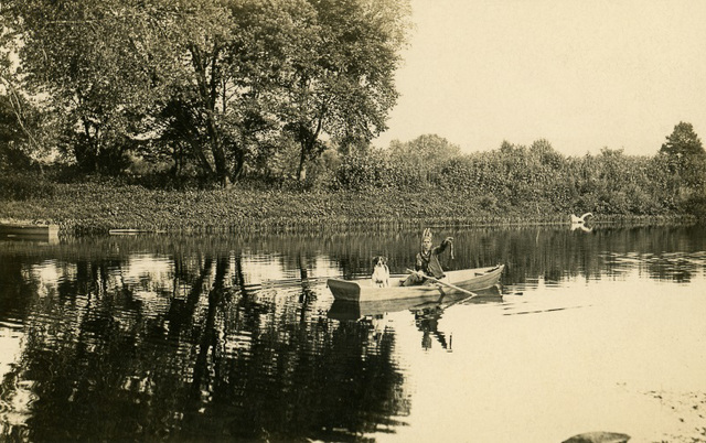 Playing Indian and Fishing with a Dog in a Rowboat