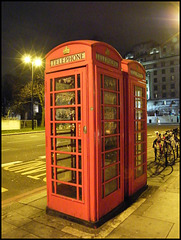 old phone boxes at night