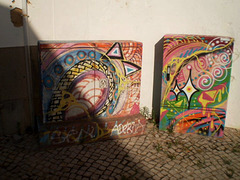 Street art on electricity boxes.