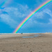 Doppelter Regenbogen am Strand