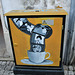Street art on electricity box, inspired on cinema.