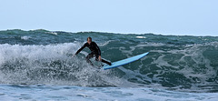 Surfer in Porth Chapel