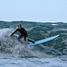 Surfer in Porth Chapel