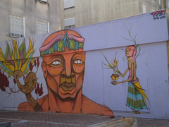 Mural by Cena 7, inspired in South-American indian tribes.