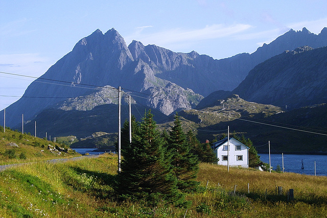 Farms at Strømsnes in Selfjorden bay, mountain Sølbjorn in the background