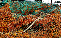 A Sea And Crashing Wave Of Fishing Nets