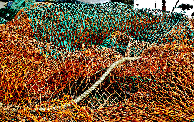 A Sea And Crashing Wave Of Fishing Nets