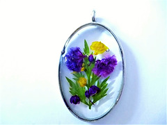 Oval shape with purple and yellow flowers