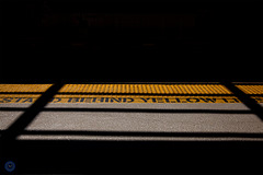 Stand behind yellow line