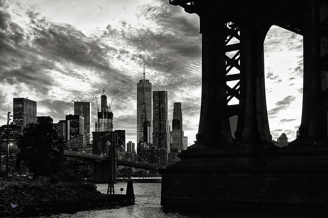 By the mighty pillars of the Manhattan Bridge.