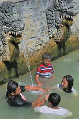 Balinese family in hot springs