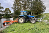 New Holland tractor pumping water