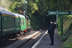 The gentleman controller oversees departure of an afternoon train to Alton