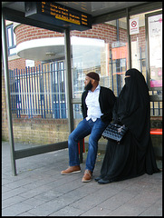 faceless woman at the bus stop