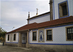 Tiles covering outside walls of church.