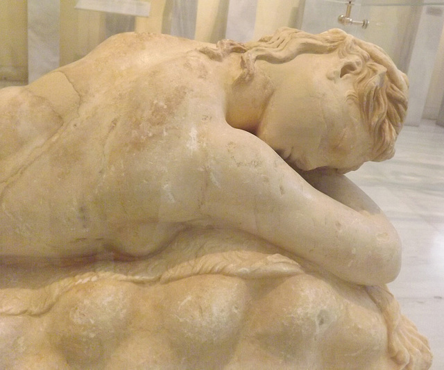 Detail of a Statue of a Sleeping Maenad from the Athenian Acropolis in the National Archaeological Museum in Athens, May 2014