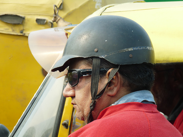 Delhi- Man With a Nibbled Helmet
