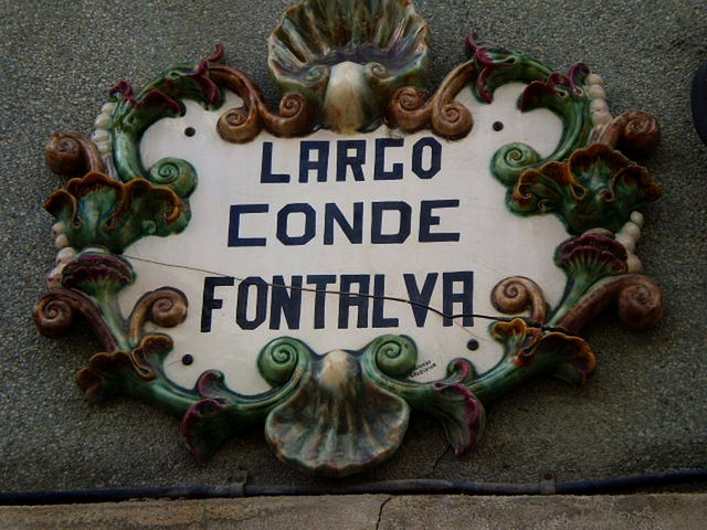 Ceramic plaque with square's name.