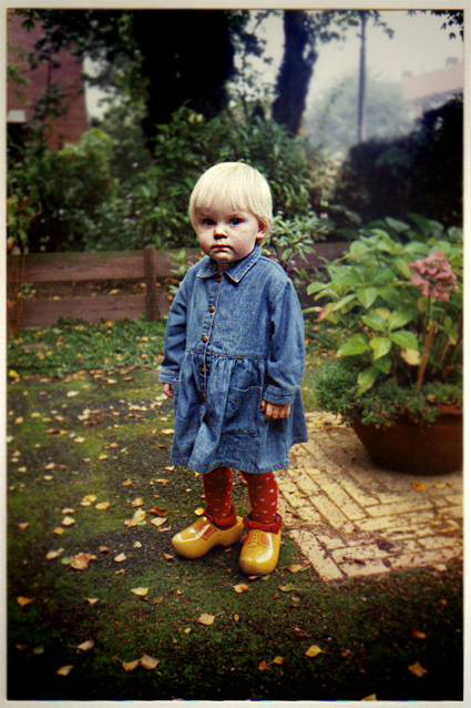 Little Dutch girl on wooden shoes.