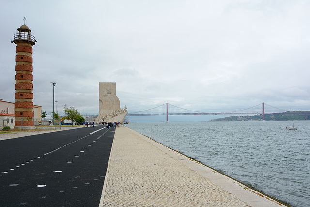 Belem Lighthouse, Monument to the Discoverers and Bridge of 25 April across Tagus River in Lisbon