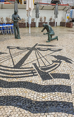 Eine Hommage der Stadt Lissabon an die Pflasterer, die den Boden, den wir betreten, bauten.