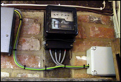 old electric meter with dials