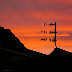 A trio of Yagi-Uda antenna (array) at sunset