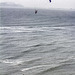 Parasailing and surfer
