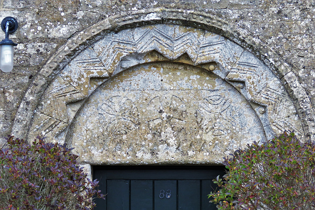 sherborne church cottage glos (3)mid c12 zigzag and a tympanum with three cross roundels