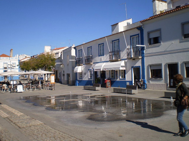 Water jets and terrace in the square.