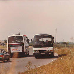 Ambassador Travel LT890 (EAH 890Y) and United Counties 174 (CNH 174X) passing at Barton Mills - 29 Jul 1984