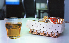 A glass of apple juice and snacks