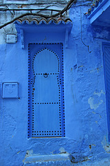Blue door with nails
