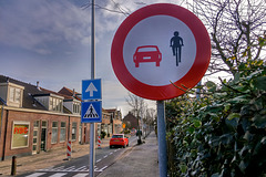 Forbidden for red cars and black cyclists