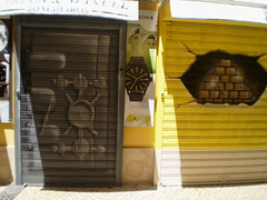 Painting on blinds of door and shop-window of jewellery.