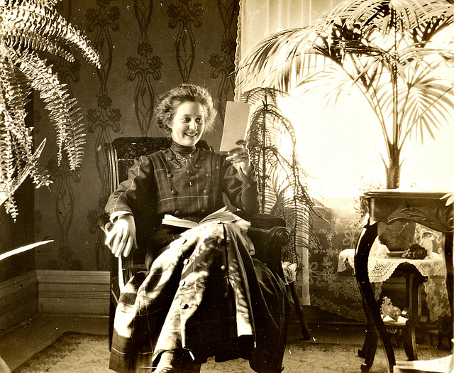My paternal grandmother c. 1910-1913, at home, reading something, Milwaukee, Wisconsin.
