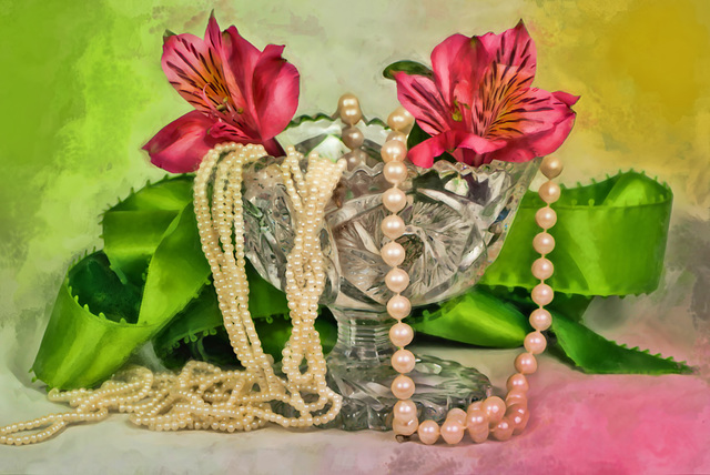 Pink flowers in a crystal vase with vintage pearls