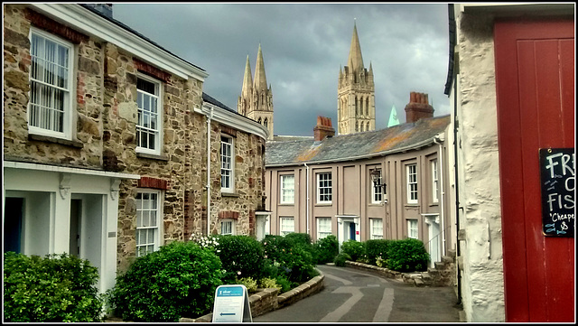Truro back street, fresh fish advert and cathedral.