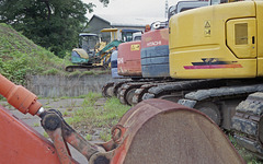 Construction equipments in the depot