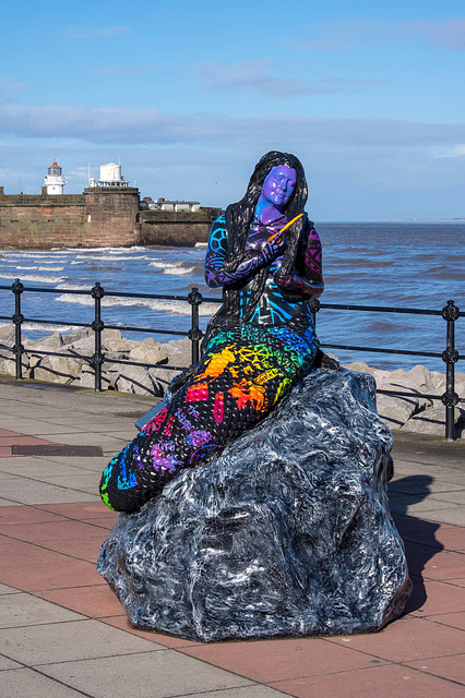 One of New Brighton 's mermaid statues